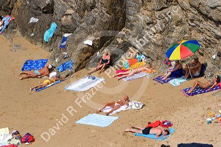 People sunbathe on the beach at Saint-Malo in Brittany, northwestern France.