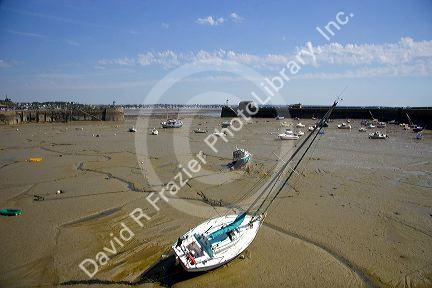 Low tide at The Harbor of Granville, a coastal commune in the department of Mache, France.