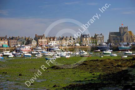 Low tide in the harbor at the village of Barfleur in the region of Basse-Normandie, France.