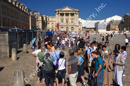 Tourists at the Palace of Versailles in Versailles in the department of Yvelines, France.
