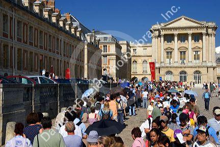Tourists at the Palace of Versailles in Versailles in the department of Yvelines, France.