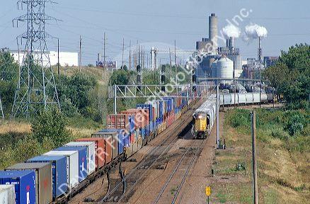 A train traveling in front of an ethanol corn processing plant in Clinton, Iowa.