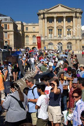 Tourists at the Palace of Versailles in Versailles in the department of Yvelines, France.