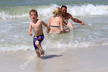 A family plays on the beach in St. Petersburg, Florida. MR