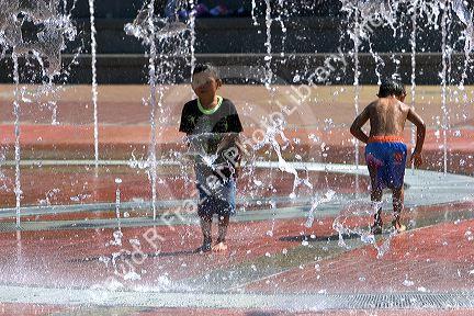 Children play in the Fountain of Rings in Centennial Olympic Park, Atlanta, Georgia.