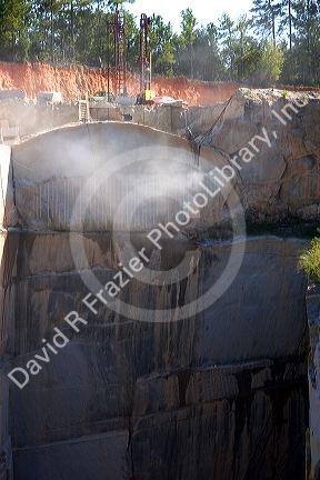 Workers drilling and cutting blocks at a granite quarry in Elberton, Georgia.
