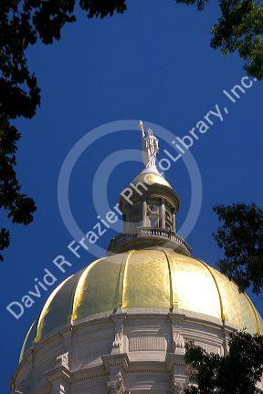 The gold leaf dome and Miss Freedom atop the Georgia State Capitol building in Atlanta.