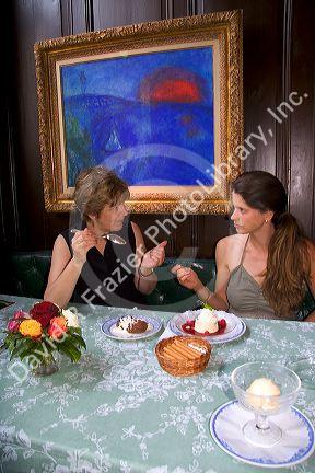 Women eating desert at the Kronenhalle restaurant in Zurich, Switzerland. MRswitzerland, swiss, europe, european, travel, tourism, swiss alps, alps, alpine, zurich, desert, kronenhalle, restaurant, painting, chagall, chagall painting, art