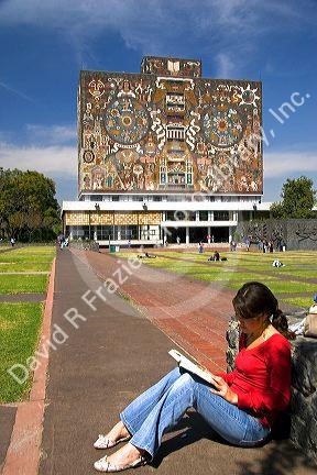 Female student studying near the Central Library on the campus of the National Autonomous University of Mexico in Mexico City, Mexico. MR