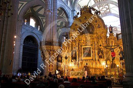 A gold alter inside the Catedral Metropolitana located on the central square, the zocalo, Mexico.