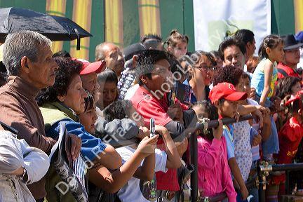 A crowd of Mexican people celebrating the Day of the Dead in the Zocalo in Mexico City, Mexico.