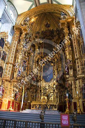 A gold alter inside the Catedral Metropolitana located in the central square, the zolalo, Mexico.