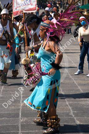 Aztec indian woman in traditional dress performing Los Concheros dance on the Day of the Dead in Mexico City, Mexico.