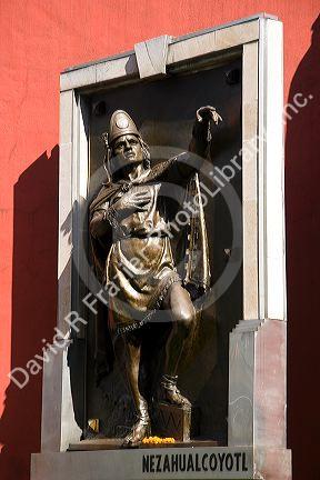 A statue of Nezahualcoyotl on the rear exterior of the Palacio de Mineria in Mexico City, Mexico.