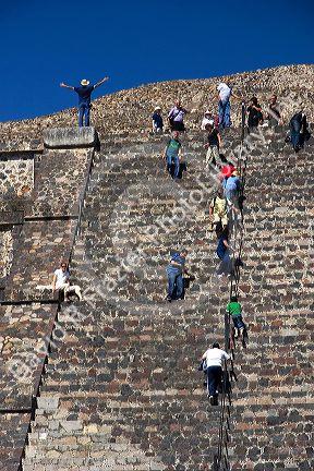 Tourists climb the steps of the Pyramid of the Moon at Teotihuacan in the State of Mexico, Mexico.