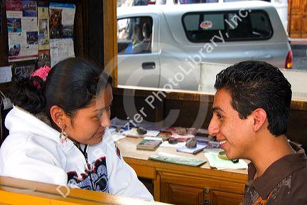 Mexican teens talk in the plaza at Taxco in the State of Guerrero, Mexico.