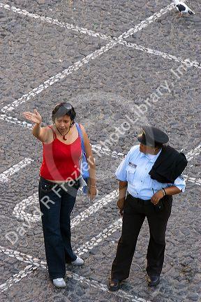 Mexican woman speaking to a female police officer at Taxco in the State of Guerrero, Mexico.