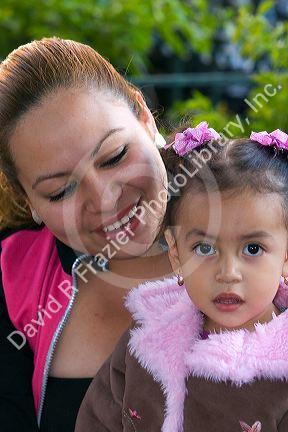 Mexican mother and daughter in the plaza at Taxco in the State of Guerrero, Mexico.