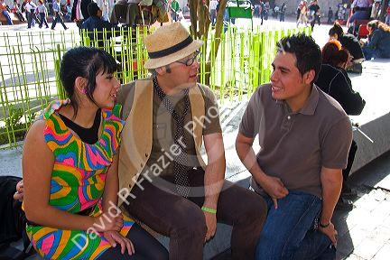 Young Mexican adults socialize at Insurgentes Plaza in Mexico City, Mexico.