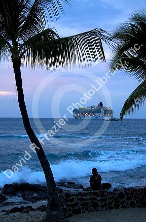 Cruise ship at sunset in the Pacific Ocean off the coast the Big Island of Hawaii.