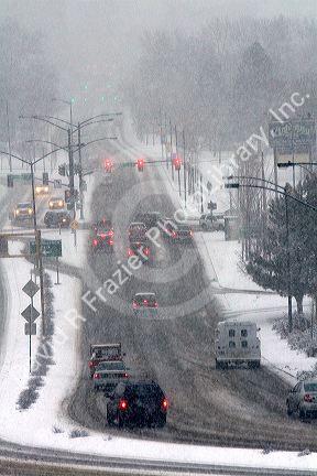 Automobiles driving on a snowy day in Boise, Idaho.