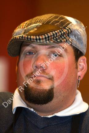 Portrait of a young man wearing a hat. MR