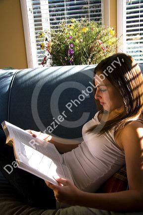 Young woman reading a book. MR
