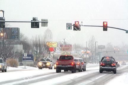 Traffic at a stop light on a snowy day in Boise, Idaho.