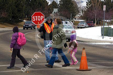School crossing guard in the winter snow in Boise, Idaho.