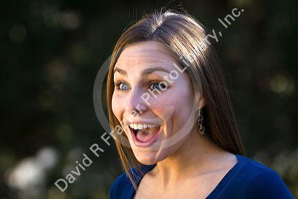 Portrait of a young woman looking surprised. MR