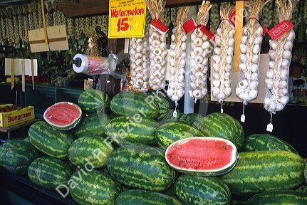 Farmers market selling watermelon and garlic in California.