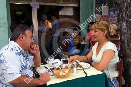 People dine outdoors at a cafe in Buenos Aires, Argentina.
