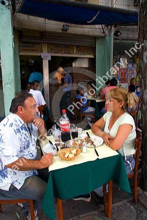 People dine outdoors at a cafe in Buenos Aires, Argentina.