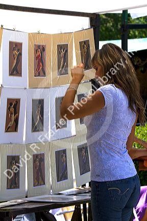 Street vendor selling prints of tango dancers in the Recoleta barrio of Buenos Aires, Argentina. MR