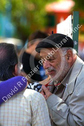 Argentine street artist on the Caminito in the La Boca barrio of Buenos Aires, Argentina.