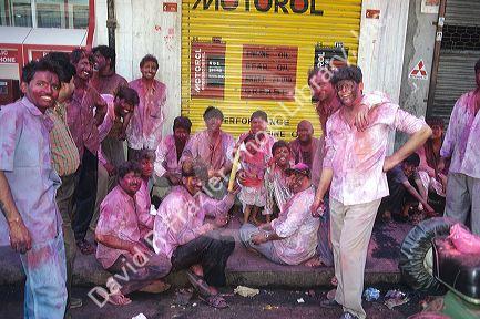 People covered in purple power at the Holi festival of colors in India.  A rite of springtime.