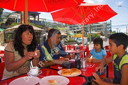 Chilean family eats lunch in Renaca, Chile. MR