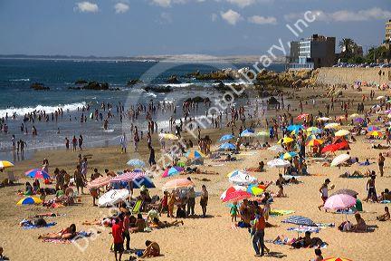 Crowded beach scene at Concon on the the Pacific Ocean in Chile.