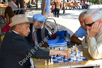 Chilean men play chess in the Plaza de Armas in Santiago, Chile.