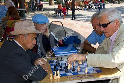 Chilean men play chess in the Plaza de Armas in Santiago, Chile.