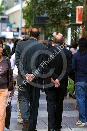 Businessmen walk on the Paseo Ahumada in Santiago, Chile.