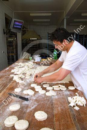 Baker making biscuits at the Panaderia Union in Tolhuin, Tierra del Fuego, Argentina.