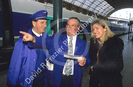 Passenger getting directions at a train station in Paris, France.