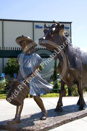 Sculpture of famous Blue Bell Cow and Girl by Veryl Goodnight at the Blue Bell Creamery in Brenham, Texas.