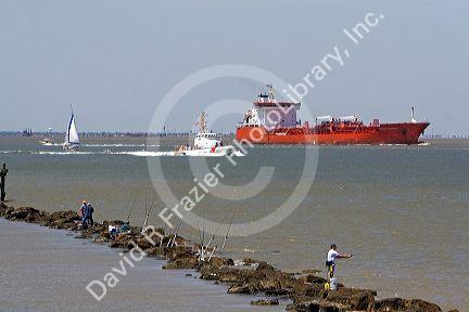 Oil tanker and Coast Guard patrol boat in Galveston Bay, Texas.