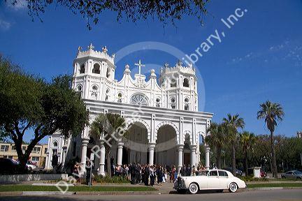 Wedding party outside the Sacred Heart Church in Galveston, Texas.