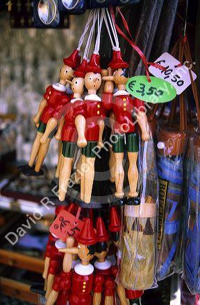 Souvenir wooden Pinocchios being sold in Pisa, Tuscany, Italy. 