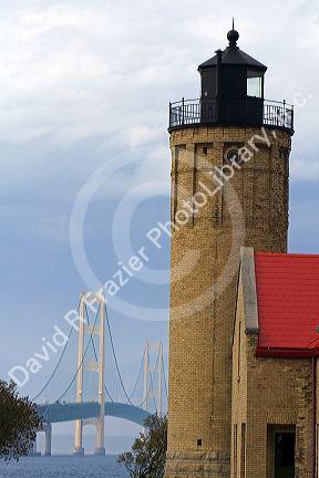 The Old Mackinac Point Lighthouse and the Mackinac Bridge at Mackinaw City, Michigan.