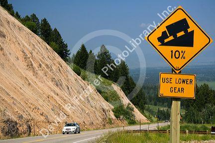 10% grade road sign atop the high mountain Teton Pass on Wyoming Highway 22 near the state border of Wyoming and Idaho.