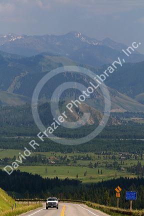 Truck traveling on the high mountain Teton Pass on Wyoming Highway 22 near the state border of Wyoming and Idaho.